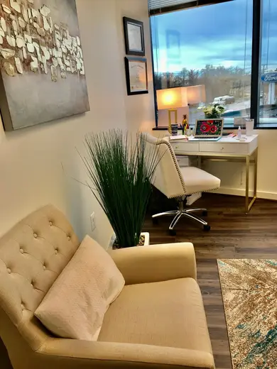 Cozy therapy office with armchair at Collide Behavioral Health, LLC detox center in Maryland.