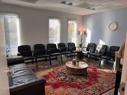 Cozy waiting area with black chairs at Second Chance Care detox center in Maryland.
