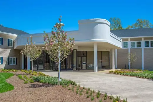 Welcoming entrance with landscaped gardens at Recovery Centers of America Capital Region partial hospitalization program in Maryland.