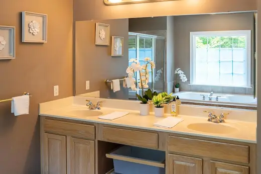 Bright bathroom with dual sinks at Sober Living - Luxury - Severn Home, a sober living home in Maryland.